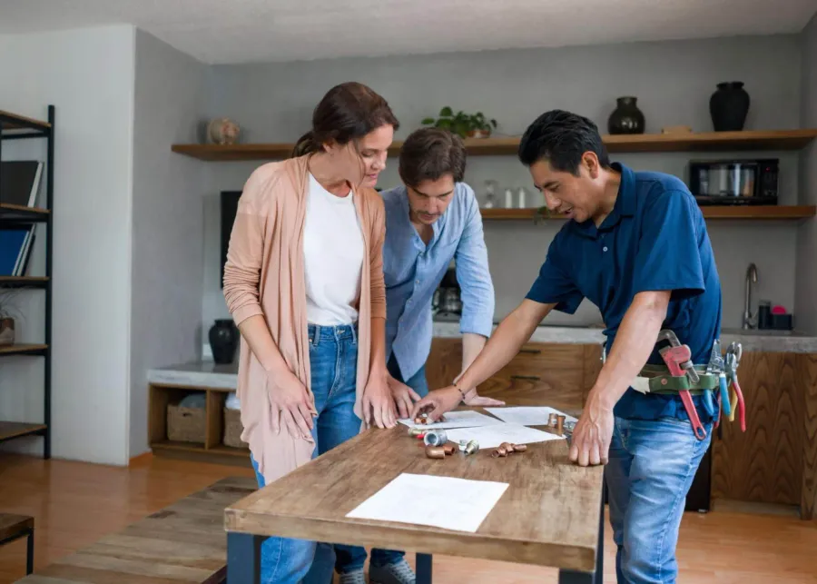 Homeowners reviewing design plans with their project specialist