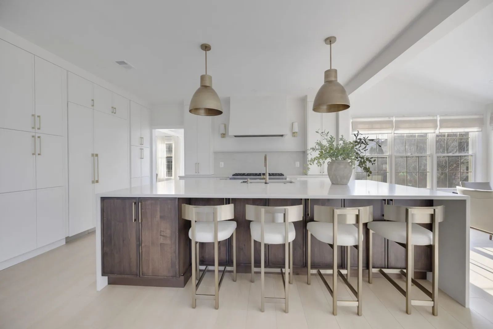 Bright kitchen with a large island, pendant lighting and vaulted ceiling
